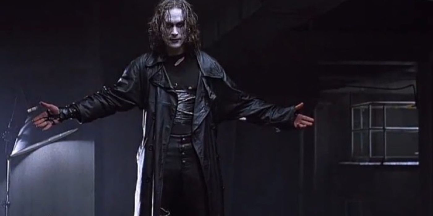 Brandon Lee holding his arms out as The Crow
