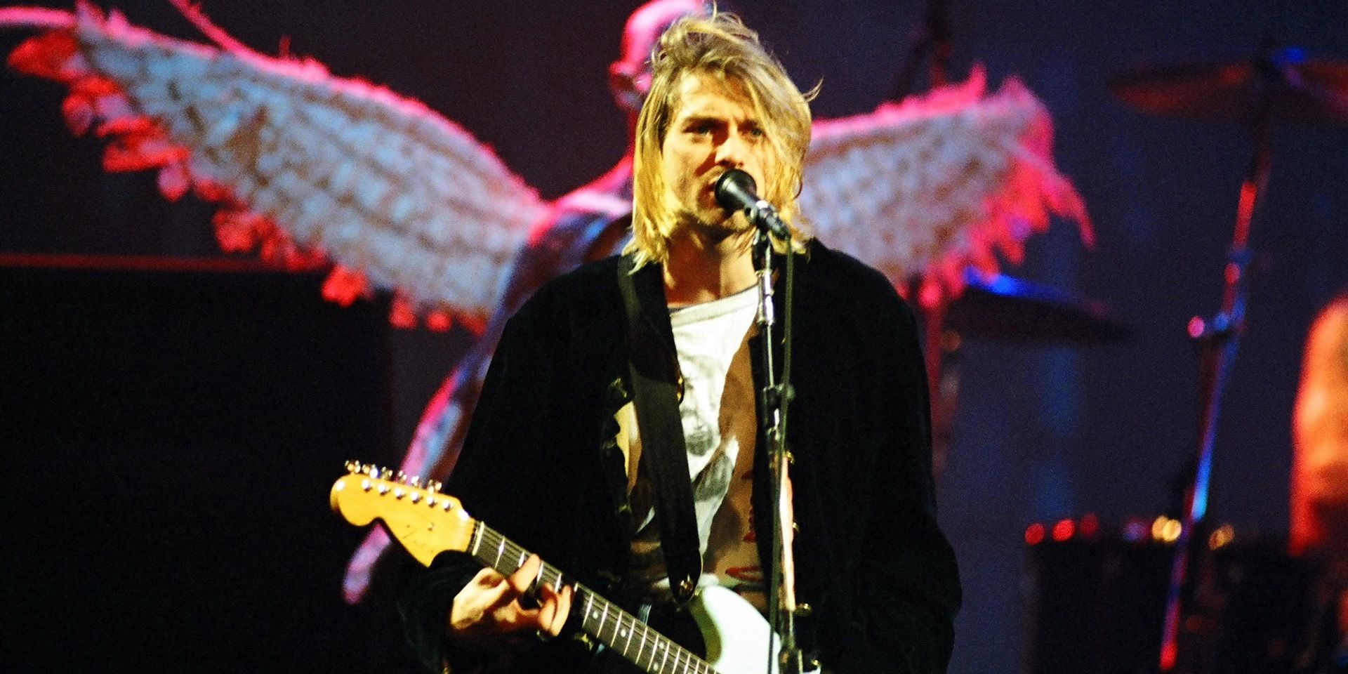 Kurt Cobain playing on stage