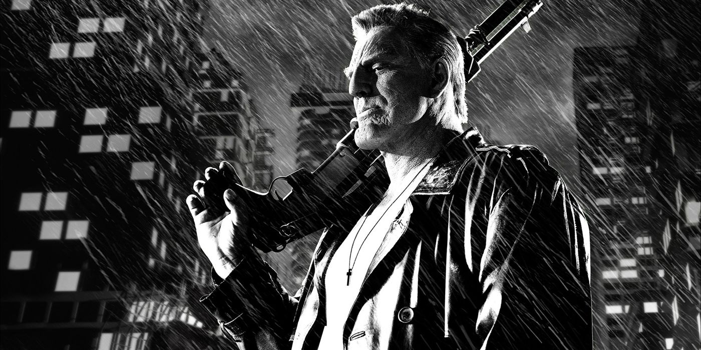 Marv holding his gun in the rain in Sin City