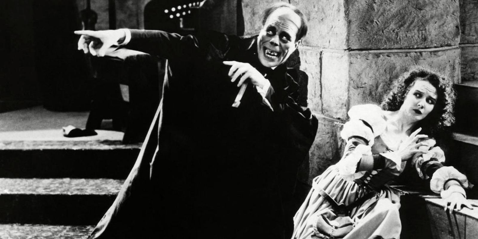 Unmasked Phantom standing over Christine in The Phantom Of The Opera 1925